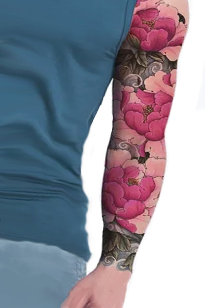 A guy in a teal shirt models the full sleeve with shades of  pink large flowers.