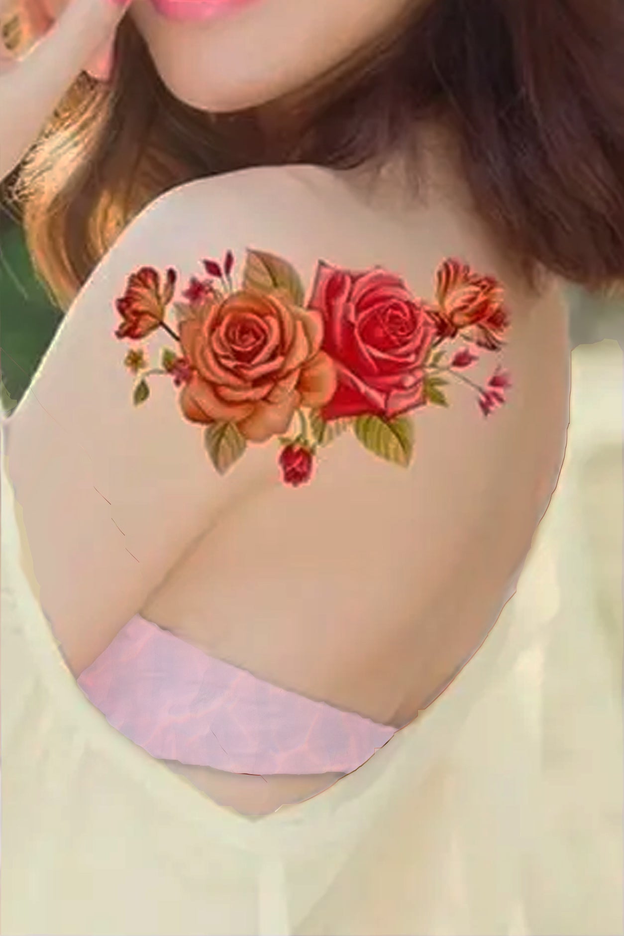 A girl displays the rose bouquet on her shoulder. A delicate bouquet of lifelike pink and deep pink roses will beautify your arm, leg, torso, hip, or chest. The delicate rose capture light and shadow just right, the spray has tiny buds and leaves in the background at the right juxtaposition.