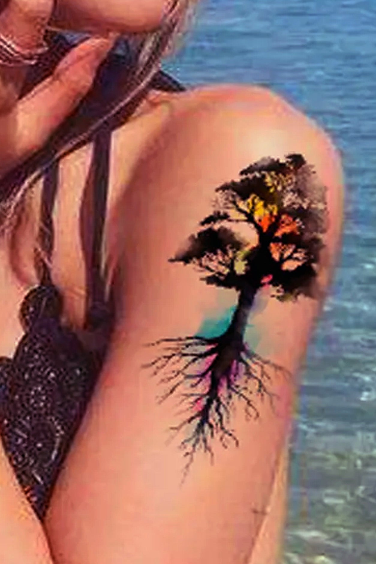 Image is the tree of life on a womans arm.